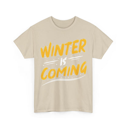 Luxury Winter Is Coming Graphic T-Shirt showcasing bold yellow lettering on a soft beige cotton fabric, perfect for stylish winter layering.