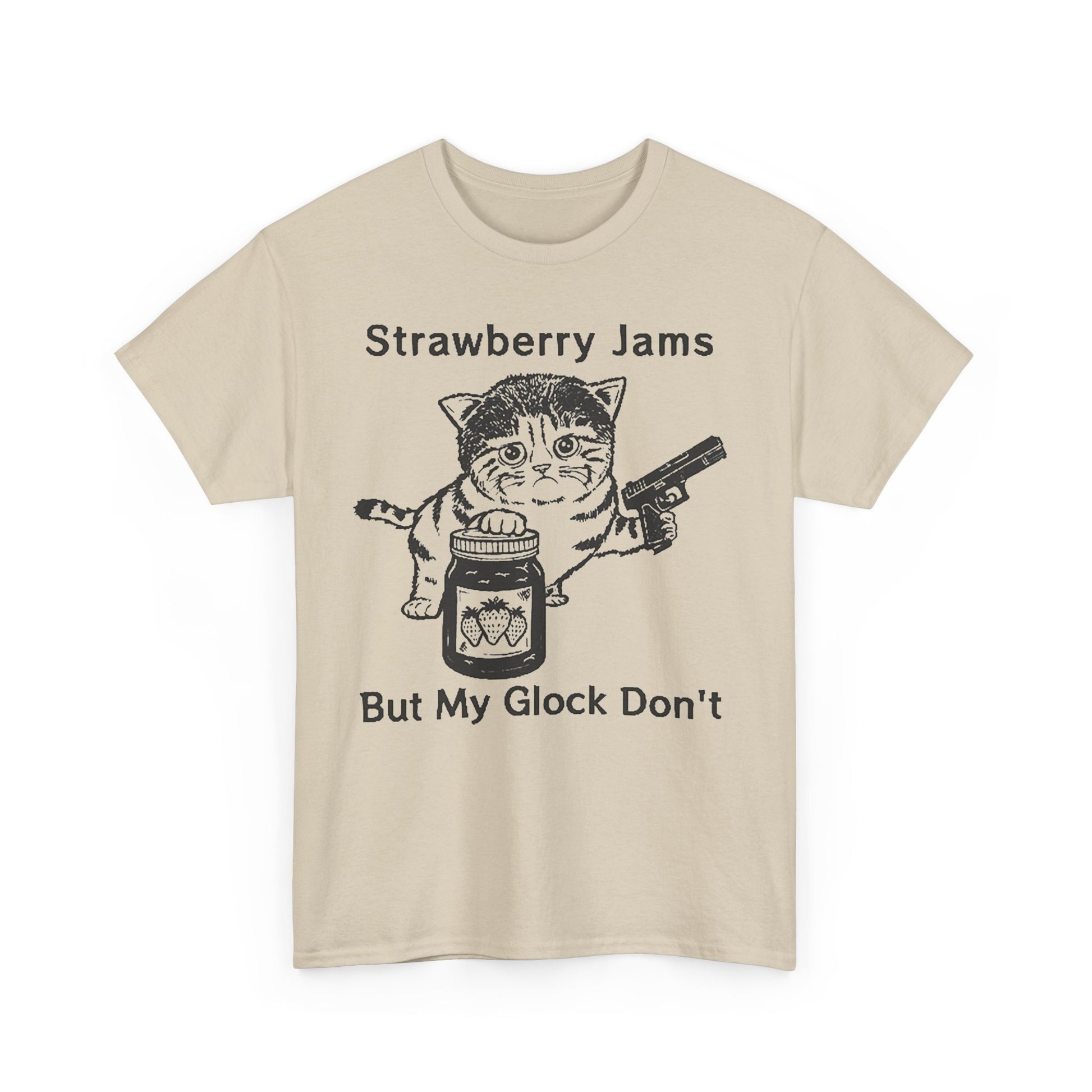 Elegant beige graphic t-shirt with a playful print of a cat holding a strawberry jam jar and a handgun, complimented by humorous text, ideal for fun fashion.