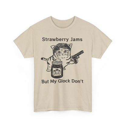 Elegant beige graphic t-shirt with a playful print of a cat holding a strawberry jam jar and a handgun, complimented by humorous text, ideal for fun fashion.
