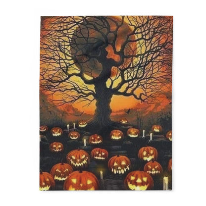 Decorative and Warm Halloween Spooky Arctic Fleece Blanket featuring a hauntingly beautiful scene of illuminated pumpkins surrounding a dark tree against a sunset sky.