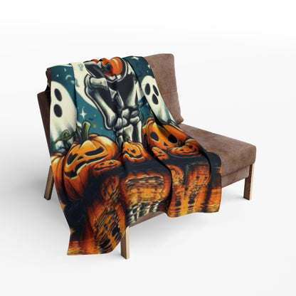 Stylish Decorative and Warm Halloween Spooky Arctic Fleece Blanket draped over a chair, featuring a vibrant skeleton and pumpkin artwork, ideal for upscale Halloween ambience.