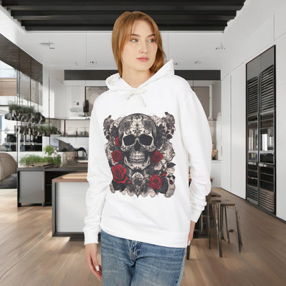 Fashion-forward model wearing a Unisex Lightweight Hooded Sweatshirt featuring an artistic designer skull and roses graphic, set against a modern kitchen backdrop.