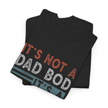 Premium black t-shirt elegantly folded, adorned with the witty statement 'It's Not A Dad Bod, It's A Father Figure' in a stylish retro design, showcasing a blend of comfort and humour.