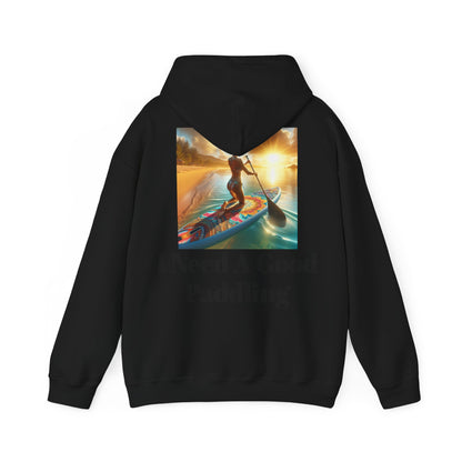 Fantasy Paddleboarding Unisex Hooded Sweatshirt featuring vibrant paddleboarding design on a black background, perfect for adventure lovers seeking style and comfort.