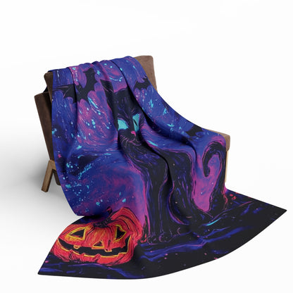 Decorative and Warm Halloween Spooky Arctic Fleece Blanket draped on a chair, featuring enchanting artwork with a black cat and a carved pumpkin, ideal for creating a luxurious autumn atmosphere.