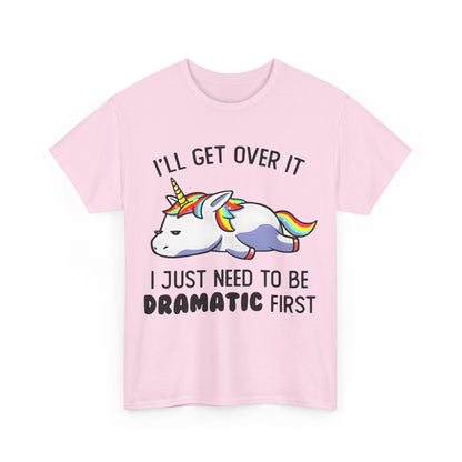 Unicorn Melancholy Graphic Tee showcasing a whimsical cartoon unicorn with a dramatic expression, designed with the slogan 'I’LL GET OVER IT, I JUST NEED TO BE DRAMATIC FIRST', perfect for adding a touch of playful luxury to your wardrobe.