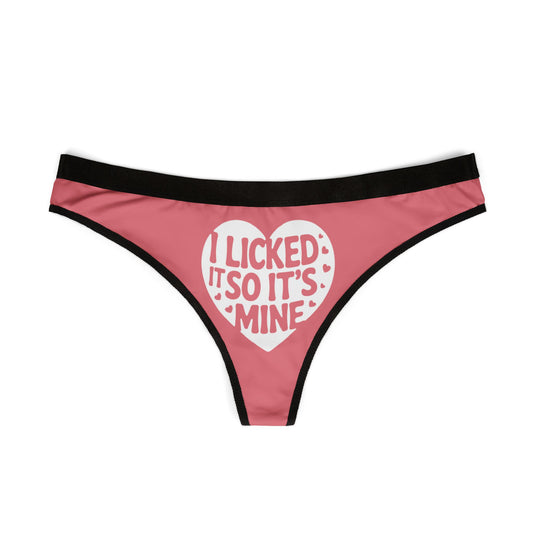 Luxurious pink women's thong featuring playful heart graphic and cheeky text 'I Licked It So It's Mine', perfect for Valentine's Day and romantic occasions.