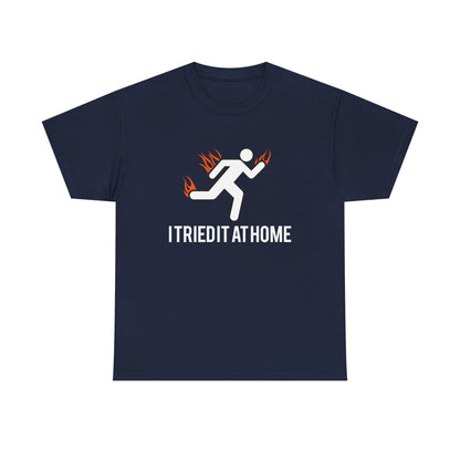 Sophisticated navy mens t-shirt adorned with a stick figure running amidst fiery accents, featuring the impactful phrase 'I TRIED IT AT HOME' for those who embrace challenges.
