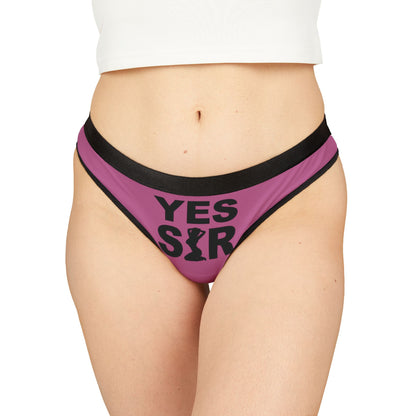 Elegant women's graphic thong in a vibrant pink shade featuring bold 'YES SIR' text, designed for playful intimacy and thoughtful gifting.