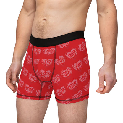 Model wearing Valentines Naughty Cheeky Men's Boxer Briefs, displaying the cheeky text and heart design, combining luxury comfort with a sense of fun.