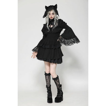 Lifestyle image of the Dark in Love Arya Gothic Lace Doll Dress worn in an elegant setting, capturing the essence of Lolita fashion with a sophisticated Gothic twist.