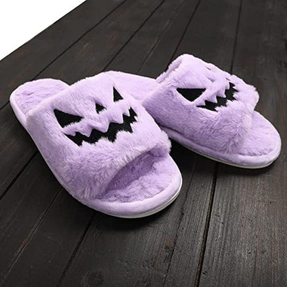 Halloween Shoes Winter Cute Warm Home Slippers Women - Stylish purple pumpkin slippers resting on a wooden surface, ideal for festive indoor wear.