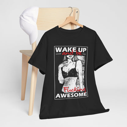 Upscale black T-shirt draped elegantly over a chair, showcasing the dynamic design with 'WAKE UP and be F***ing AWESOME' text above an alluring graphic of a woman in a chic pose.