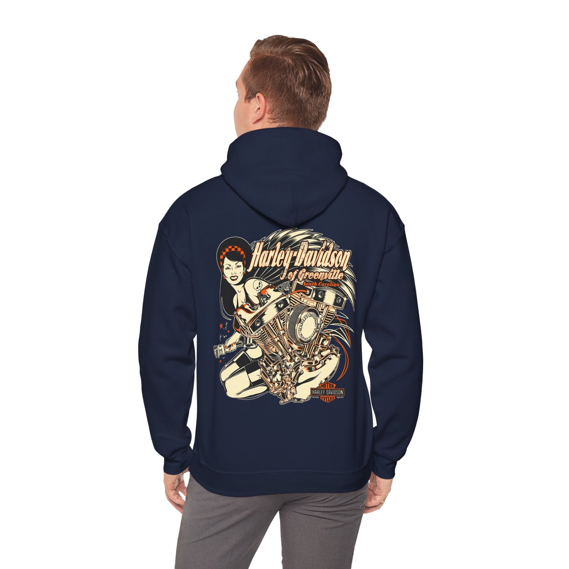 Refined navy blue Harley-Davidson back print hoodie worn by a model, featuring a striking illustration of a lady and motorcycle engine, embodying a blend of elegance and adventure.