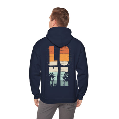 Man wearing the Vintage Love Back Print Hoodie, displaying its captivating graphic of palm trees and the word 'LOVE', radiating summer vibes and effortless elegance.