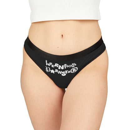 Luxurious black thong worn by a model, prominently showcasing the whimsical 'INTERNATIONAL Pornstar®' graphic, perfect for expressing your fun and flirty side.