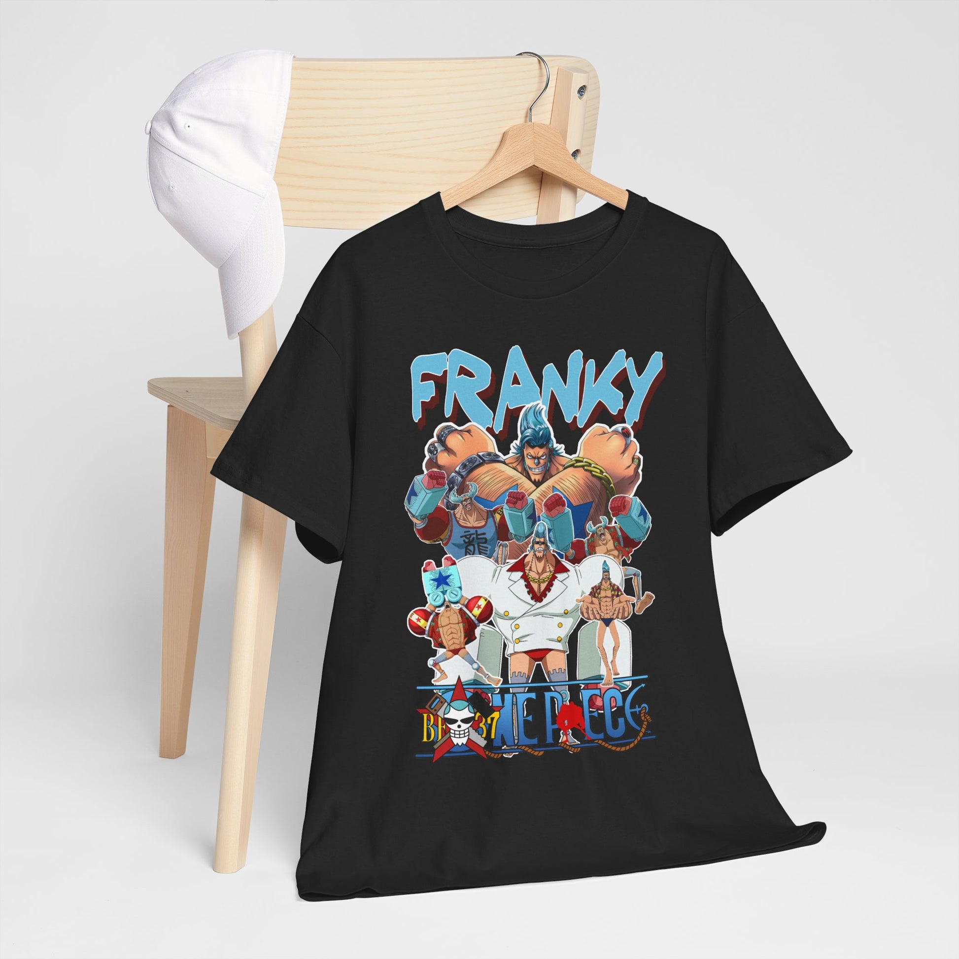Chic Franky t-shirt resting on a wooden chair next to a stylish cap, highlighting unique anime design and superior quality fabric for sophisticated casual attire.