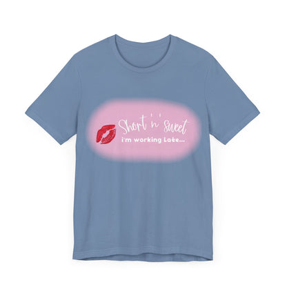 Front view of the blue variant of the Sabrina Carpenter Inspired Unisex Short Sleeve Tee, displaying the vibrant lipstick print and playful text embellishment.