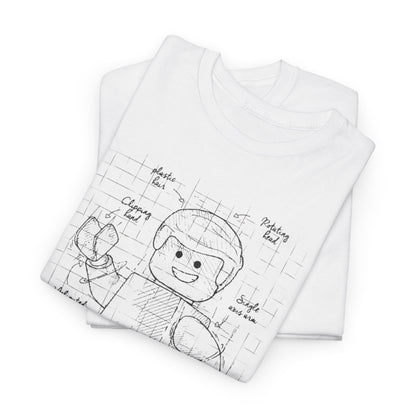 Lego Figure Unisex Mens Women's Graphic Funny T-Shirt Tee, elegantly folded to reveal a charming technical design, blending retro aesthetics with playful humour, ideal for both casual and stylish occasions.