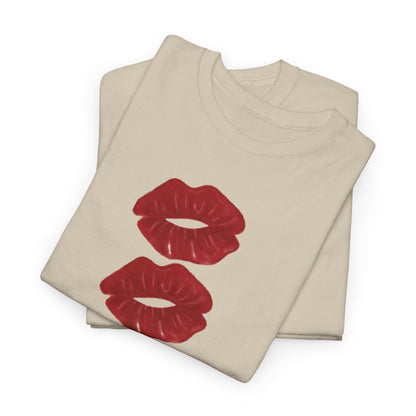 Luxurious unisex t-shirt featuring a playful design of two vivid crimson lips on a soft beige fabric, perfect for expressing love and whimsy.