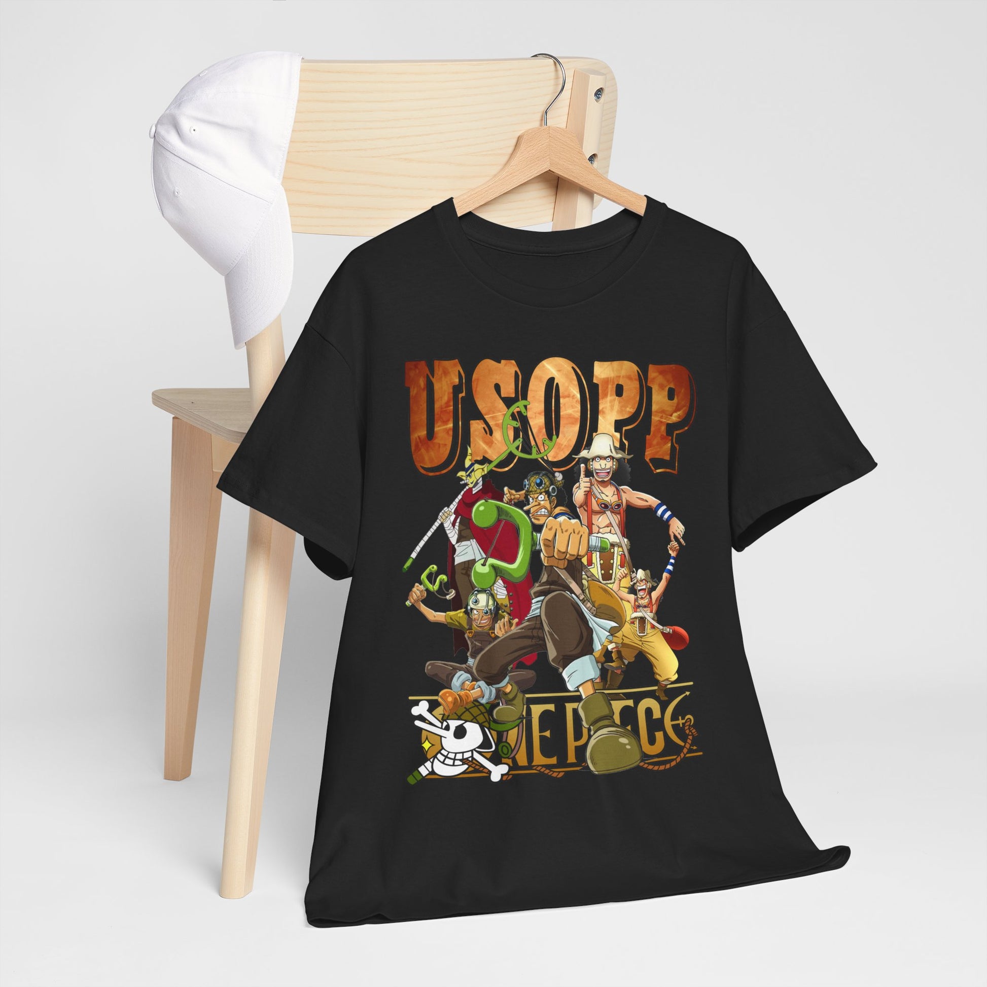 Stylish Usopp anime t-shirt elegantly displayed on a chair with a white cap, showcasing dynamic characters and premium design for discerning collectors.