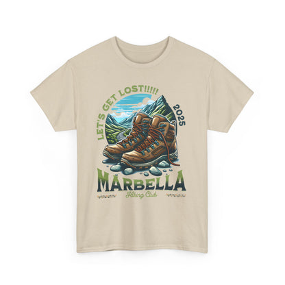 Marbella Hiking Club Unisex Graphic Tee in soft beige, showcasing a striking illustration of hiking boots with a mountain view, ideal for stylish exploration.