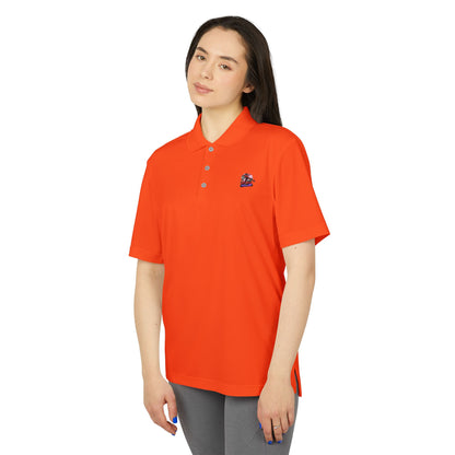 Front view of a model wearing the Adidas Unisex Performance Polo Shirt in orange, crafted from eco-friendly 100% recycled polyester, blending luxury with sustainability.