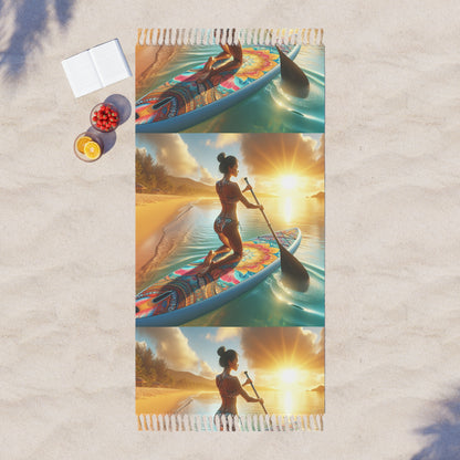 Chic Boho Beach Cloth for Paddleboarding laid on sandy beach, showcasing vibrant artwork of a woman paddleboarding at sunset. Ideal for luxurious picnics and relaxing moments on the shore.