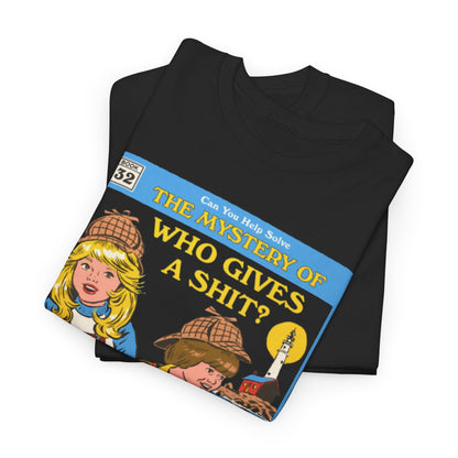 Chic black t-shirt neatly folded, adorned with the playful cover art of 'The Mystery of Who Gives a Shit?', perfect for those who appreciate unique fashion statements in luxury casual wear.