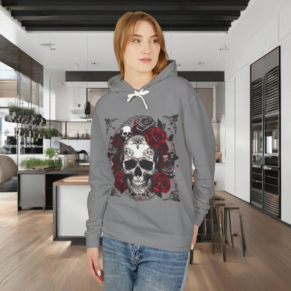 Model wearing the light grey Unisex Lightweight Hooded Sweatshirt with a striking skull and roses design, situated in a modern kitchen setting.