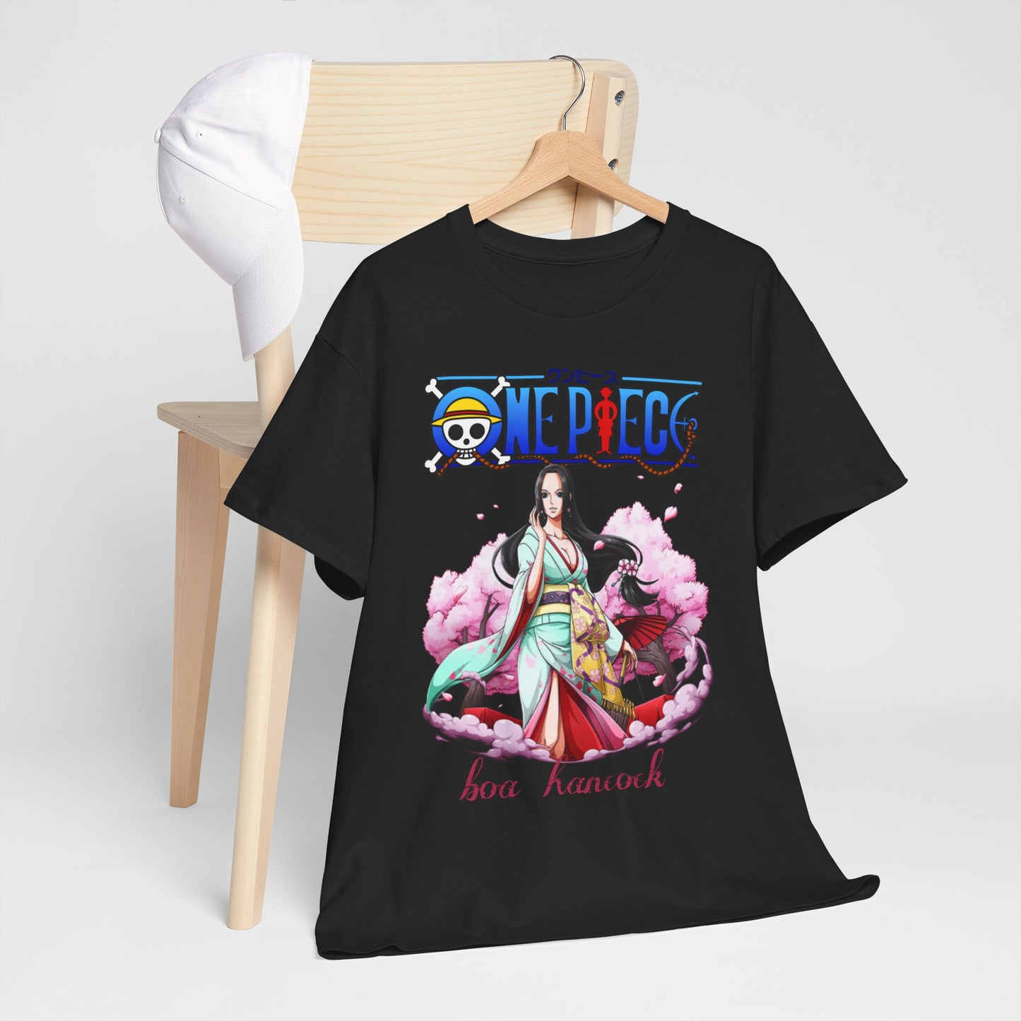 Chic men's t-shirt with Boa Hancock from One Piece, elegantly draped over a wooden chair with a cap, showcasing a blend of luxury and casual style for anime fans.