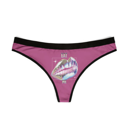 Elegant thong showcasing a glossy holographic lip graphic with the wording 'EAT ME', rendered in a chic pink tone with contrasting black trim.