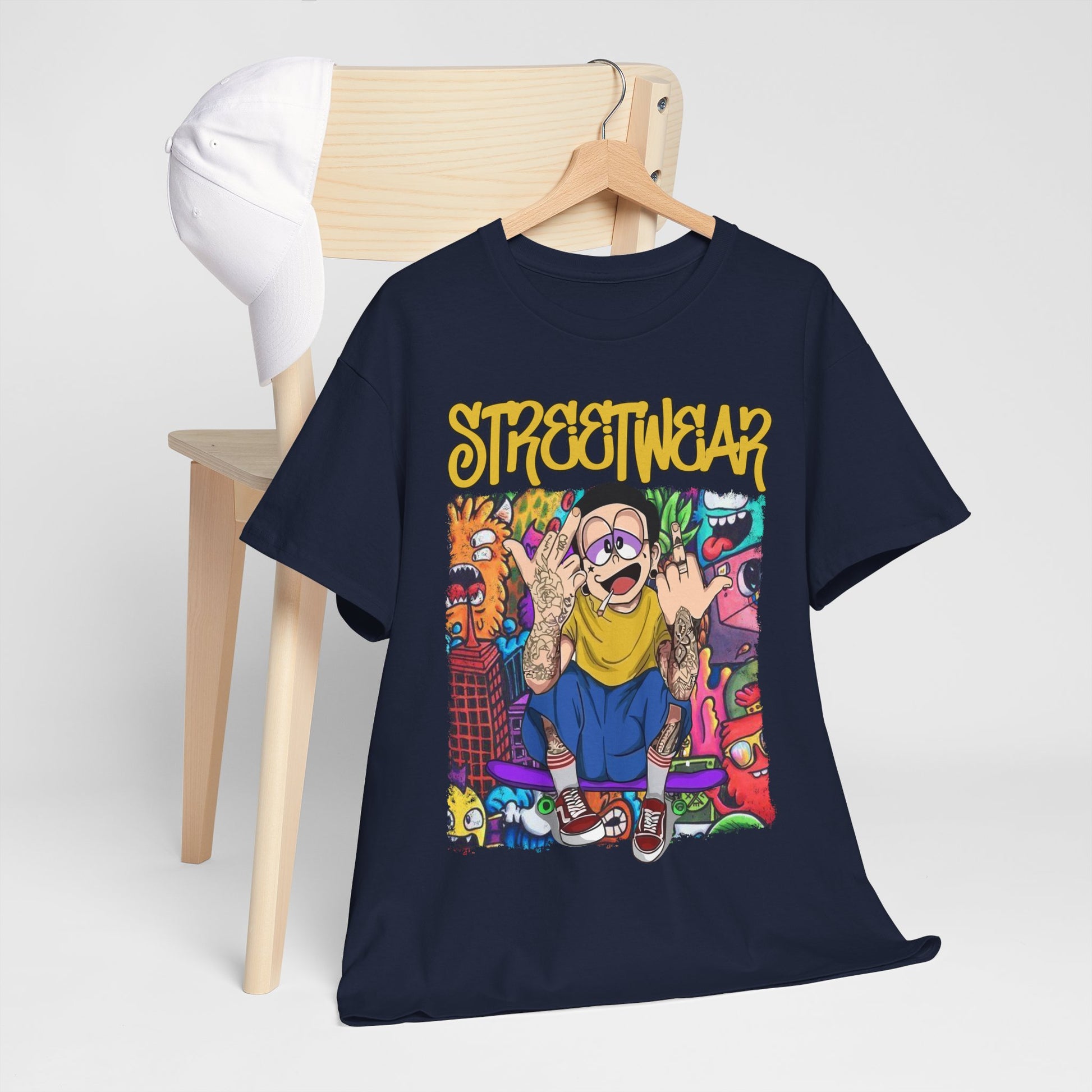 Refined photo of a fashionable streetwear t-shirt draped over a chair, complemented by a cap, highlighting the unique cartoon graphic and bold colours.