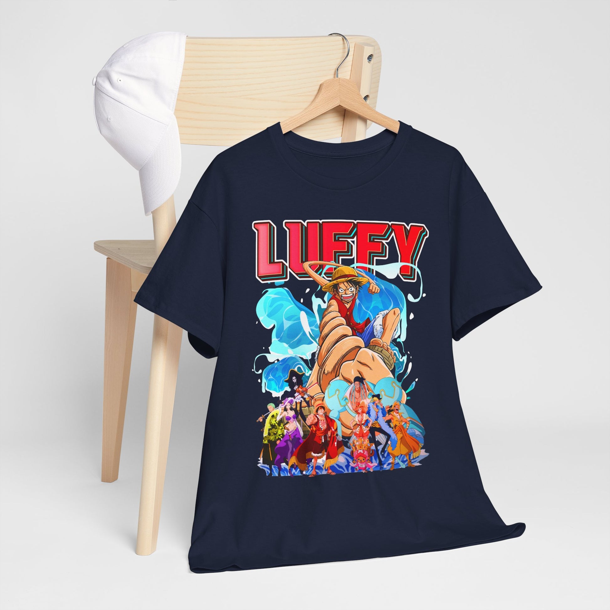 Luxury navy blue men's graphic t-shirt featuring a bold Luffy design from anime, set on an elegant wooden hanger against a minimalist background with a white cap.