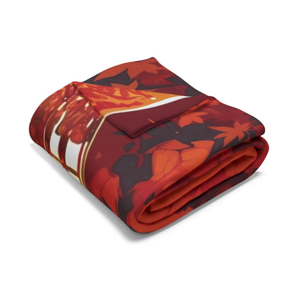 Decorative and Warm Halloween Spooky Arctic Fleece Blanket, elegantly folded showcasing vivid Halloween designs against a rich autumnal background.