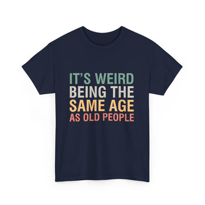 Stylish navy T-shirt featuring the whimsical phrase 'It’s Weird Being The Same Age As Old People,' blending comfort with a luxurious urban style.