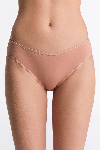 Beautifully arranged women's organic cotton briefs in assorted sizes, emphasizing luxury and sustainability in fashion.