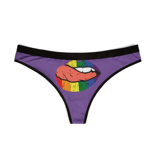 Elegant women's thong showcasing a striking illustration of rainbow lips, elegantly displayed on a purple fabric, perfect for adding a humorous touch to intimate wear.