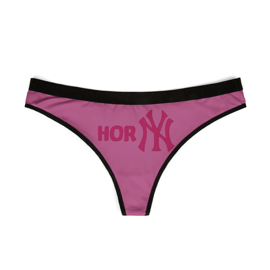 Luxurious women's pink thong featuring playful 'HORNY' design with elegant black waistband, perfect for adding a cheeky touch to intimate wear and exuding confidence.