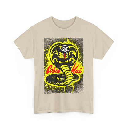 Stylish Cobra Kai graphic tee showcasing the famous Cobra logo with vibrant yellow accents on a luxurious beige background, ideal for casual outings.