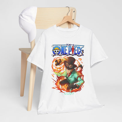 Artfully styled luxury men's white T-shirt placed on a wooden chair, showcasing a bold Sabo print from One Piece, complemented by a trendy cap.