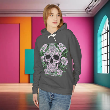 Model showcasing a Unisex Lightweight Hooded Sweatshirt with an artistic skull and roses print, set against a vibrant background that enhances its luxurious appeal.