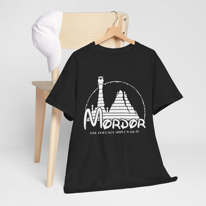 Luxurious black t-shirt featuring a stylized graphic design of Mordor, with the phrase 'ONE DOES NOT SIMPLY WALK IN' elegantly printed, showcased on a wooden chair with a white baseball cap.