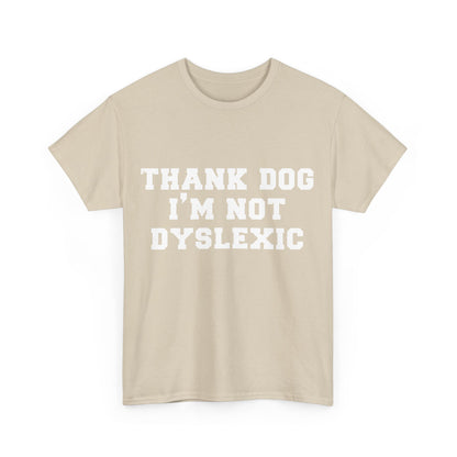 Stylish beige unisex cotton t-shirt displaying the phrase "THANK DOG I'M NOT DYSLEXIC" in prominent white lettering, ideal for chic everyday wear.