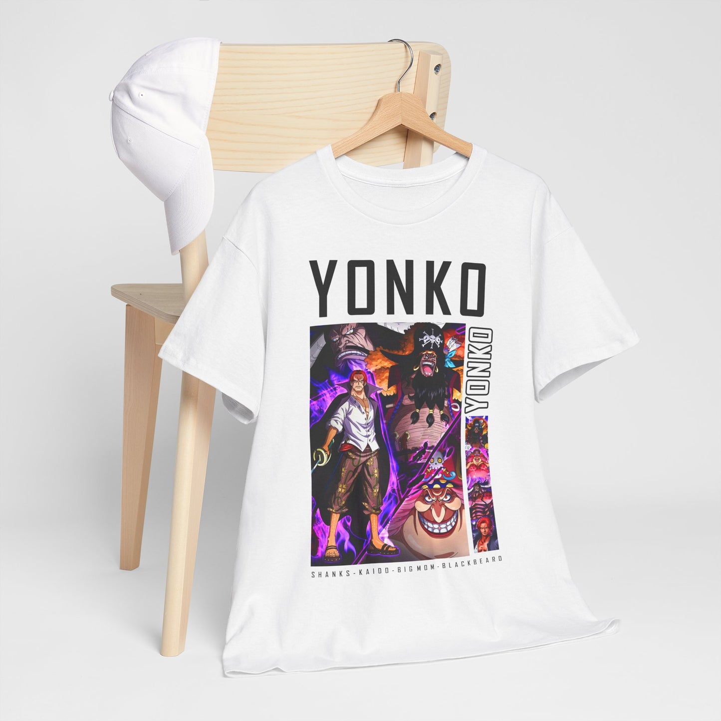 Chic YONKO anime tee draped over a wooden chair alongside a classic cap, highlighting the captivating designs of popular characters, perfect for a trendy everyday look.