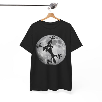Sophisticated black t-shirt elegantly hanging, featuring a whimsical silhouette of Wile E. Coyote against a majestic full moon, perfect for a stylish casual look.