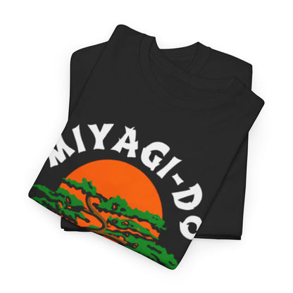 Folded Miyagi-Do Karate T-shirts showcasing a chic design with a tree and orange sun motif, ideal for stylish martial arts enthusiasts.