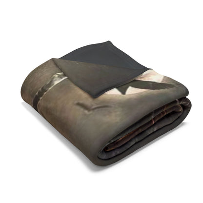 Chic folded Arctic fleece blanket with a spooky design, perfect for luxurious Halloween settings, highlighting exquisite craftsmanship and a plush texture.