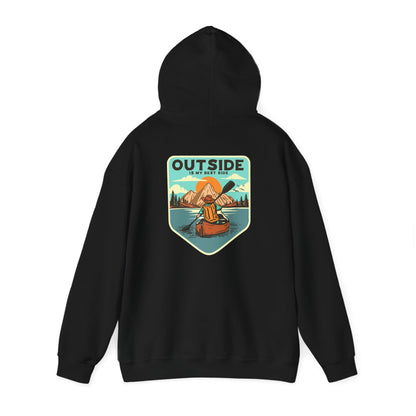 Chic black hoodie displayed from the back, featuring an artistic retro design of a kayaker on a calm lake, symbolising the spirit of adventure with an elegant message 'OUTSIDE IS MY BEST SIDE'.