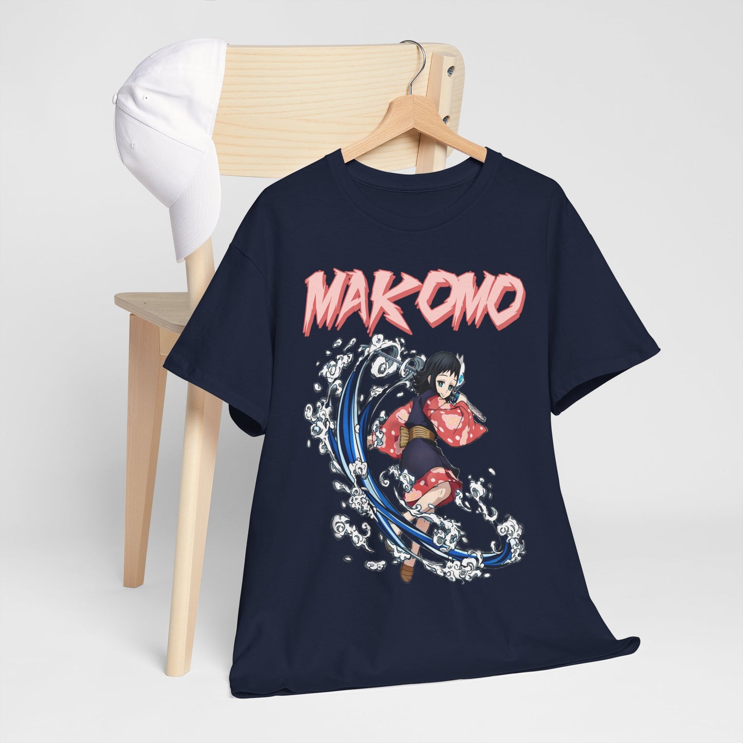 Chic Makomo Anime T-Shirt artistically displayed on a chair with a cap, highlighting the unique anime character design.